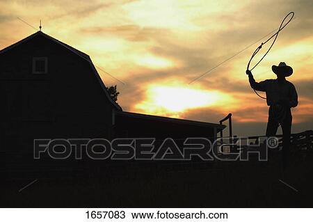Stock Image - Cowboy with lariat. Fotosearch