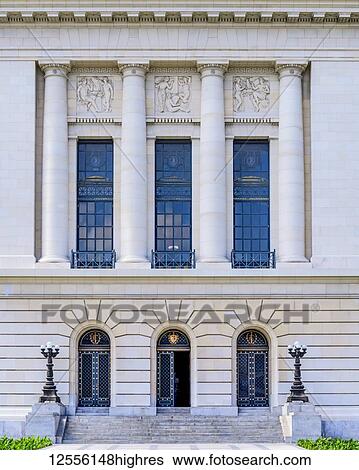 Stock Photograph - Decorative facade of a building with three windows and three doorways; Havana, Cuba. Fotosearch
