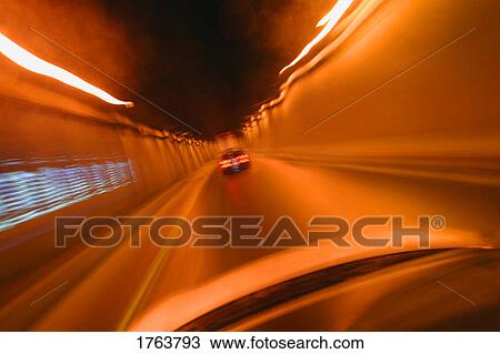 Driving through a tunnel View Large Photo Image Stock Image - Driving through a tunnel. Fotosearch