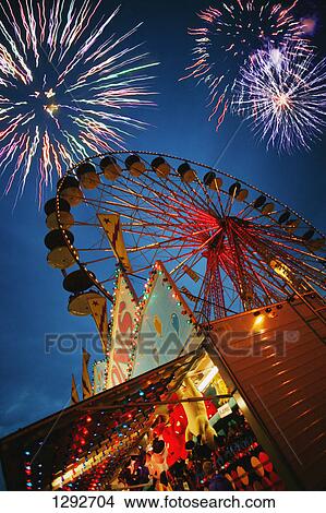 Fireworks at an amusement park View Large Photo Image Picture - Fireworks at an amusement park. Fotosearch