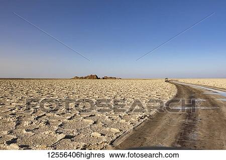 Stock Photograph - Four-wheel drive vehicle on the salt flats of Lake Karum (Lake Assale), Danakil Depression; Afar Region, Ethiopia. Fotosearch