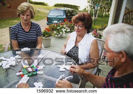 Friends playing a game View Large Photo Image Stock Image - Friends playing a game. Fotosearch