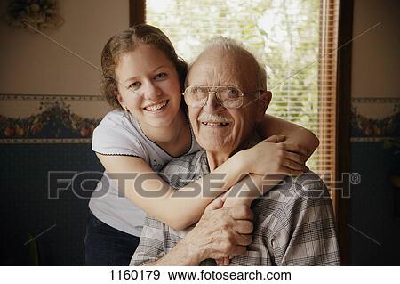 Stock Photo - Girl and senior together. Fotosearch