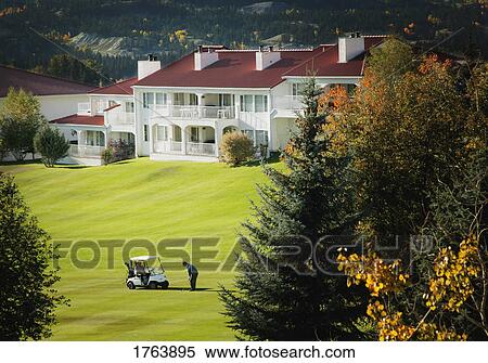 Stock Photography - Golfer in the mountains. Fotosearch