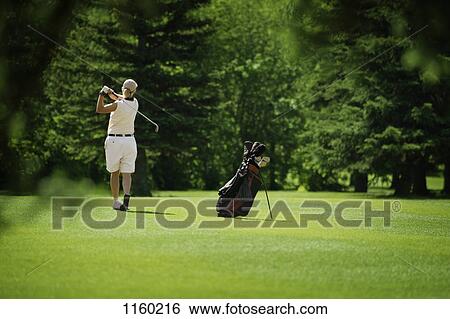 Golfer on fairway View Large Photo Image Stock Photograph - Golfer on fairway. Fotosearch