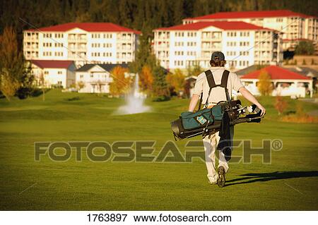 Stock Photo - Golfer on the course. Fotosearch