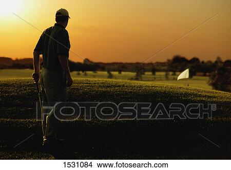 Golfing at twilight View Large Photo Image Picture - Golfing at twilight. Fotosearch