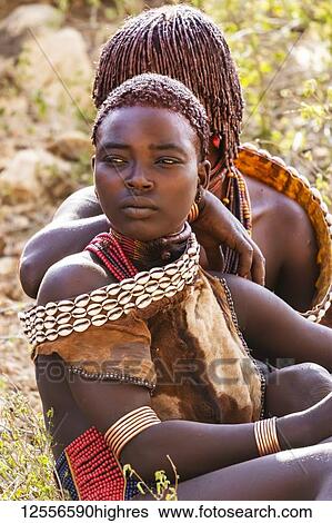 Hamer women at a bull jumping ceremony, which initiates a boy into manhood, in the village of Asile; Omo Valley, Ethiopia View Large Photo Image Stock Photograph - Hamer women at a bull jumping ceremony, which initiates a boy into manhood, in the village of Asile; Omo Valley, Ethiopia. Fotosearch