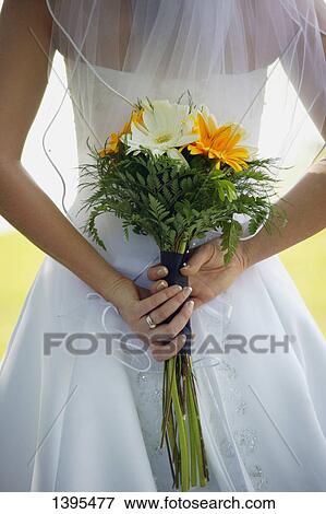 Holding bouquet View Large Photo Image Stock Photo - Holding bouquet. Fotosearch