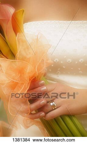 Picture - Holding her bouquet. Fotosearch