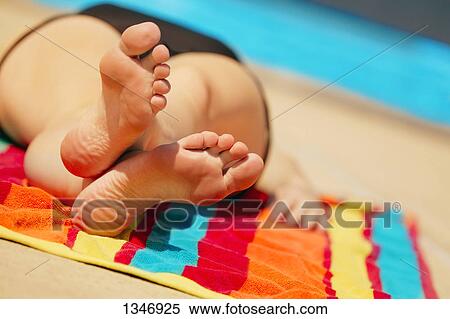 Stock Image - Laying down to relax. Fotosearch - Search Stock Photos, Mural Pictures, Photographs, and Photo Clipart