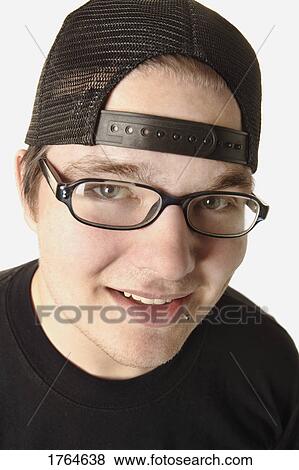 Stock Photo - Man with hat on backwards. Fotosearch