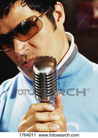 Man with microphone View Large Photo Image Stock Image - Man with microphone. Fotosearch