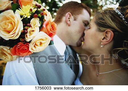 Stock Image - Married couple kiss. Fotosearch