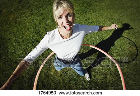 Mother plays with hoop View Large Photo Image Stock Image - Mother plays with hoop. Fotosearch