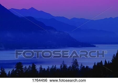 Mountains at sunrise/sunset View Large Photo Image Stock Photograph - Mountains at sunrise/sunset. Fotosearch