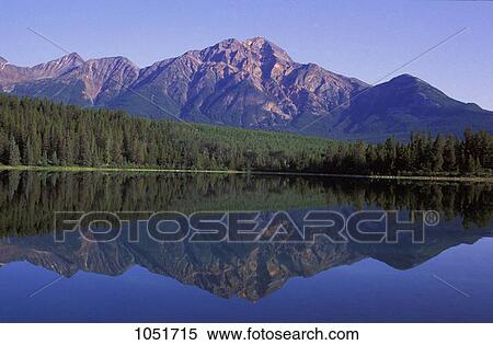 Stock Photography - Mountains trees and a lake. Fotosearch