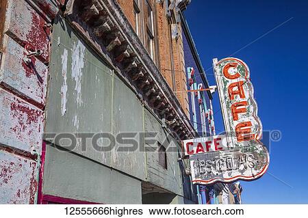 Stock Photograph - Old neon sign mounted on the exterior wall of an abandoned cafe; Raton, New Mexico, United States of America. Fotosearch
