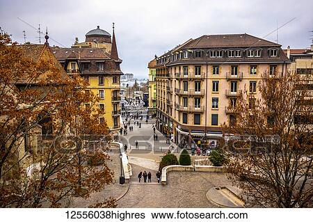Stock Photograph - Pedestrians on the walkways between buildings in Geneva; Geneva, Geneva, Switzerland. Fotosearch