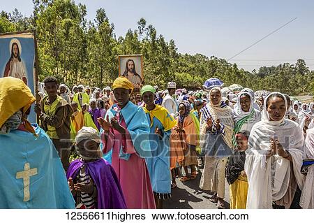 Stock Photograph - People in a Timkat procession during the Orthodox Tewahedo celebration of Epiphany, celebrated on January 19th; Sodo, Southern Nations Nationalities and Peoples' Region, Ethiopia. Fotosearch