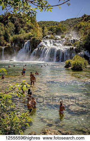 Stock Photograph - People swimming in the Krka River at the Krka waterfalls, Krka National Park; Croatia. Fotosearch