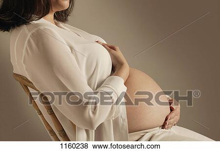 Pregnant belly View Large Photo Image Stock Photo - Pregnant belly. Fotosearch