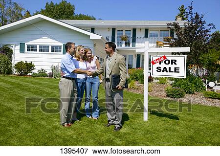 Realtor sells a house View Large Photo Image Stock Photo - Realtor sells a house. Fotosearch