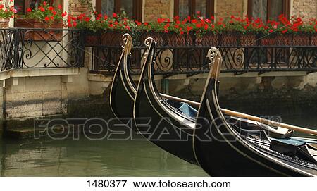 Residential scene of gondolas in a side street canal in Venice Italy Europe View Large Photo Image Stock Photo - Residential scene of gondolas in a side street canal in Venice Italy Europe. Fotosearch