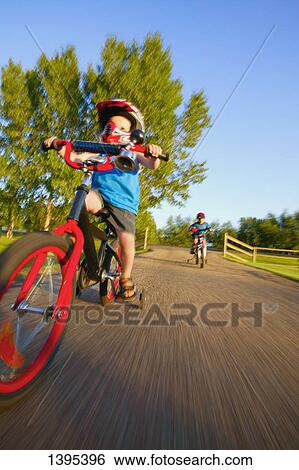 Riding a bike View Large Photo Image Stock Photograph - Riding a bike. Fotosearch