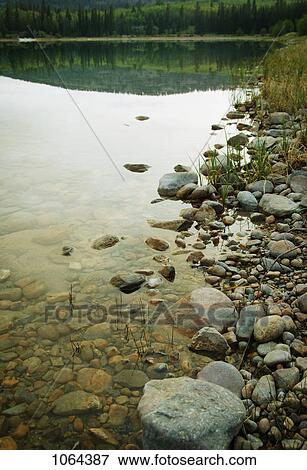 Stock Photo - Rocks at the shore. Fotosearch