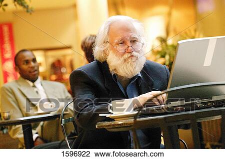 Stock Image - Senior on a computer. Fotosearch