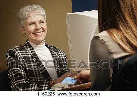 Stock Photograph - Service with a smile. Fotosearch
