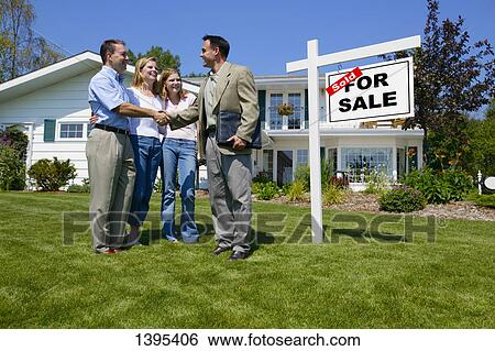 Stock Photograph - Shaking hands with realtor. Fotosearch