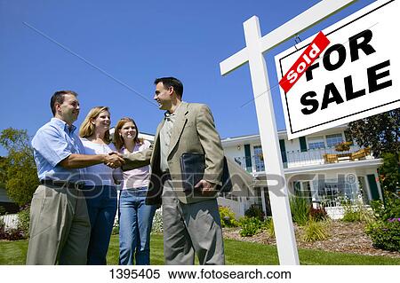 Stock Photography - Shaking hands with realtor. Fotosearch