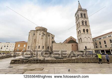 Stock Photograph - St Donatus Church and the Tower of St Anastasia's Cathedral; Zadar, Croatia. Fotosearch