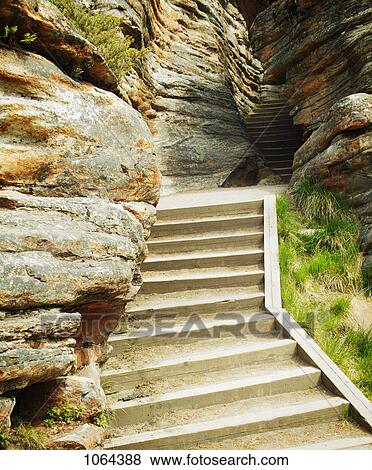 Stock Photo - Stairs into a cave. Fotosearch