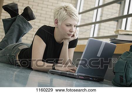 Student with lap top in hallway View Large Photo Image Stock Photo - Student with lap top in hallway. Fotosearch
