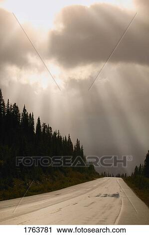 Sun breaking through the clouds Jasper National Park Alberta View Large Photo Image Stock Image - Sun breaking through the clouds Jasper National Park Alberta. Fotosearch