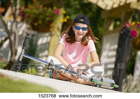 Teenager with a scooter View Large Photo Image Stock Photo - Teenager with a scooter. Fotosearch