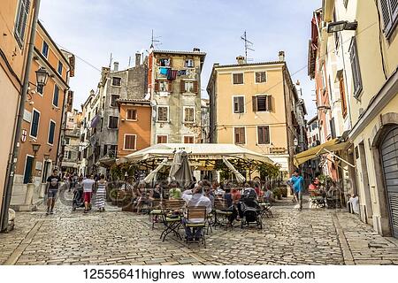 Terrace in between two very narrow streets; Rovinj, Croatia View Large Photo Image Stock Photograph - Terrace in between two very narrow streets; Rovinj, Croatia. Fotosearch