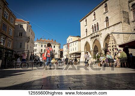 Stock Photograph - Tourists mix with locals in Nardoni Trg or National Place in the Old City; Split, Croatia. Fotosearch