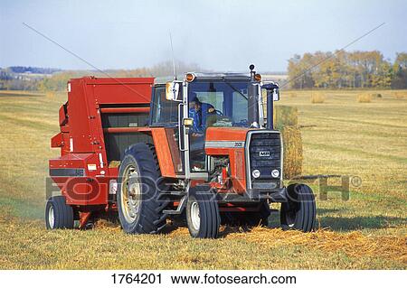 Tractor in a field View Large Photo Image Stock Image - Tractor in a field. Fotosearch