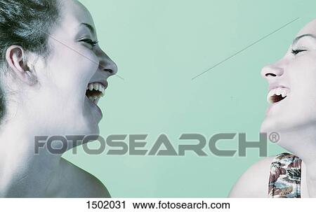 Two girlfriends laugh View Large Photo Image Stock Image - Two girlfriends laugh. Fotosearch