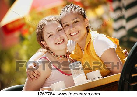 Picture - Two girls spending time together. Fotosearch