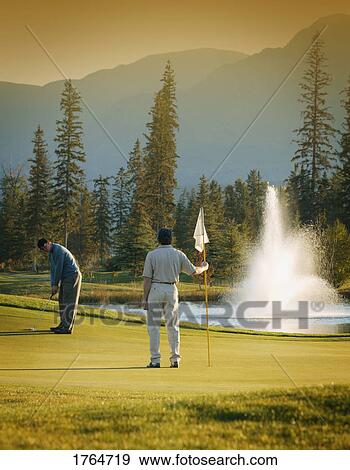 Stock Photo - Two golfers. Fotosearch