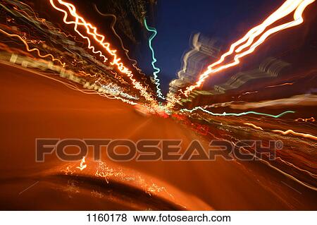 Vehicle speeding down a road View Large Photo Image Stock Photo - Vehicle speeding down a road. Fotosearch