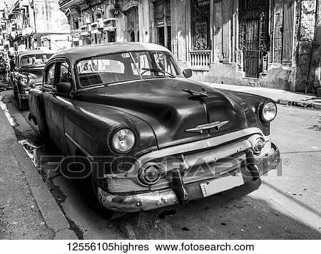 Stock Photograph - Vintage cars on the streets of Havana; Havana, Cuba. Fotosearch
