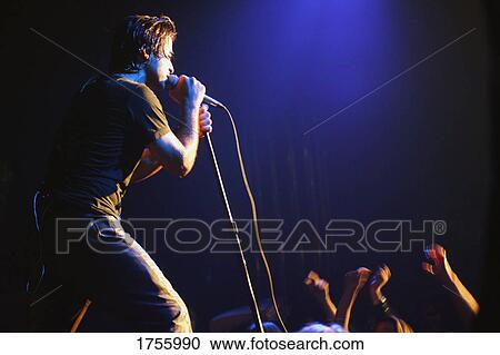 Vocalist singing to crowd View Large Photo Image Stock Image - Vocalist singing to crowd. Fotosearch