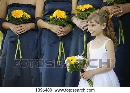 Stock Image - Wedding party with flower girl. Fotosearch