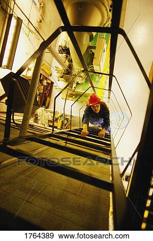 Stock Photo - Woman climbs ladder. Fotosearch